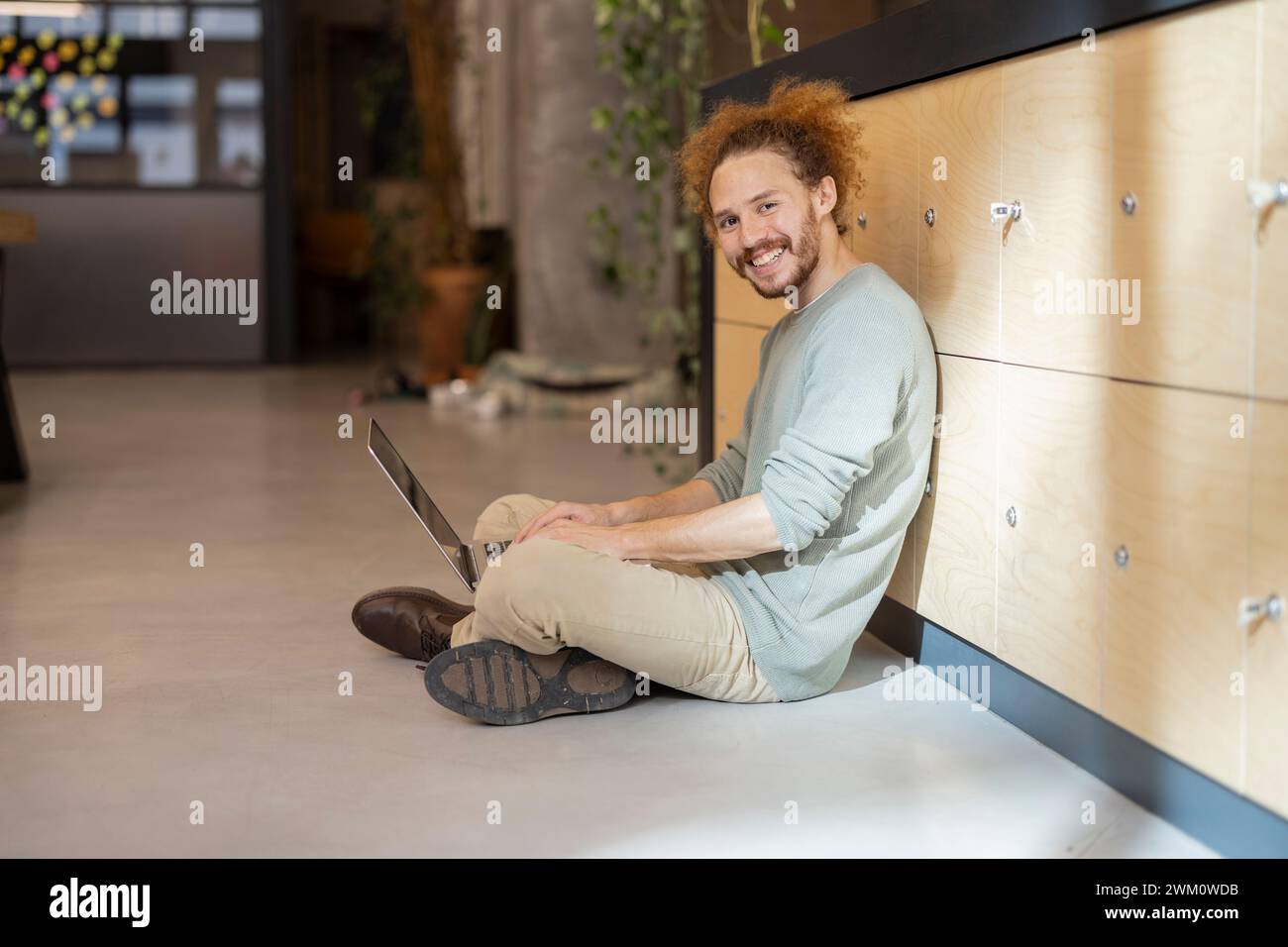 Mid adult man sitting cross legged ground hi-res stock photography and ...