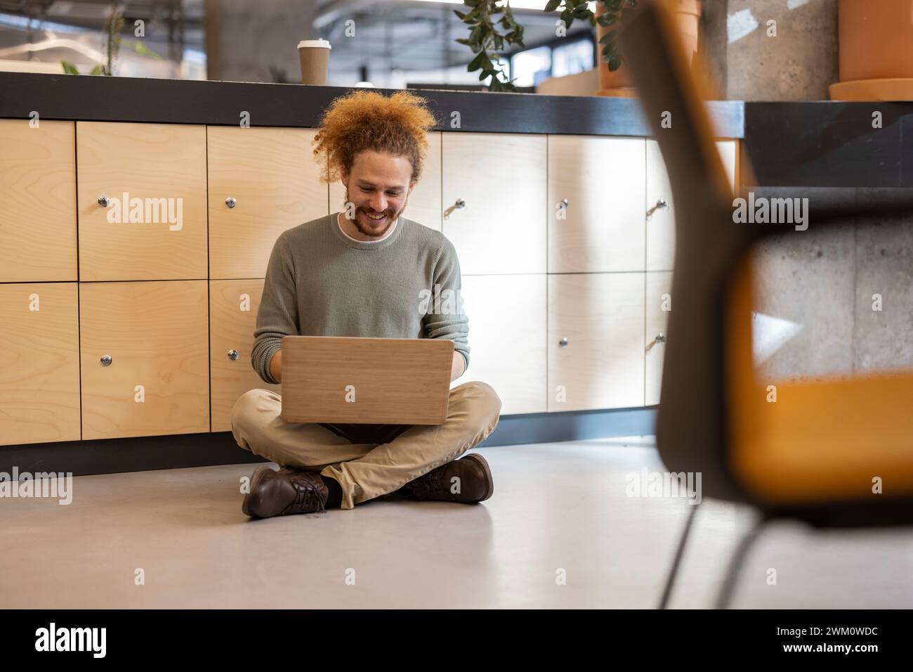 Businessman sitting cross legged on floor hi-res stock photography and ...