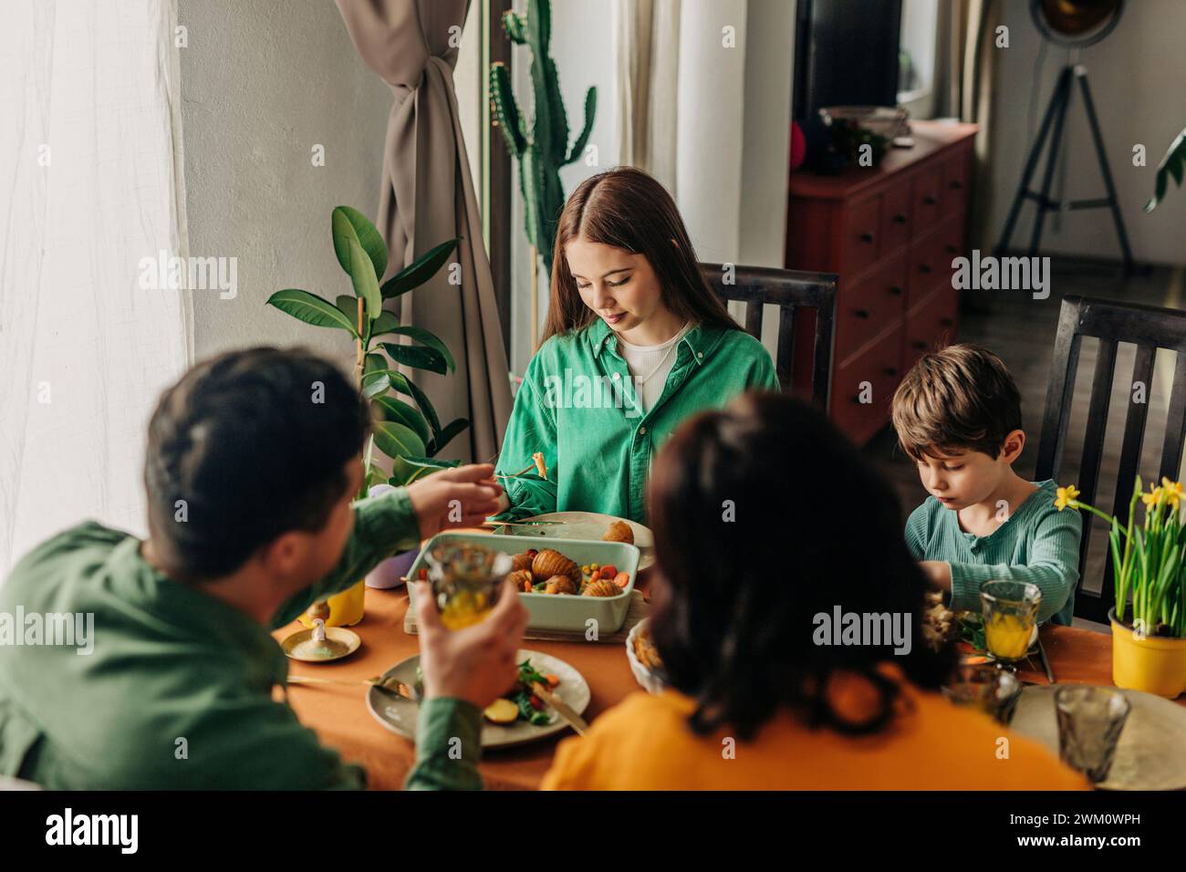 Having Table Children having meal table hi-res stock photography and images - Alamy