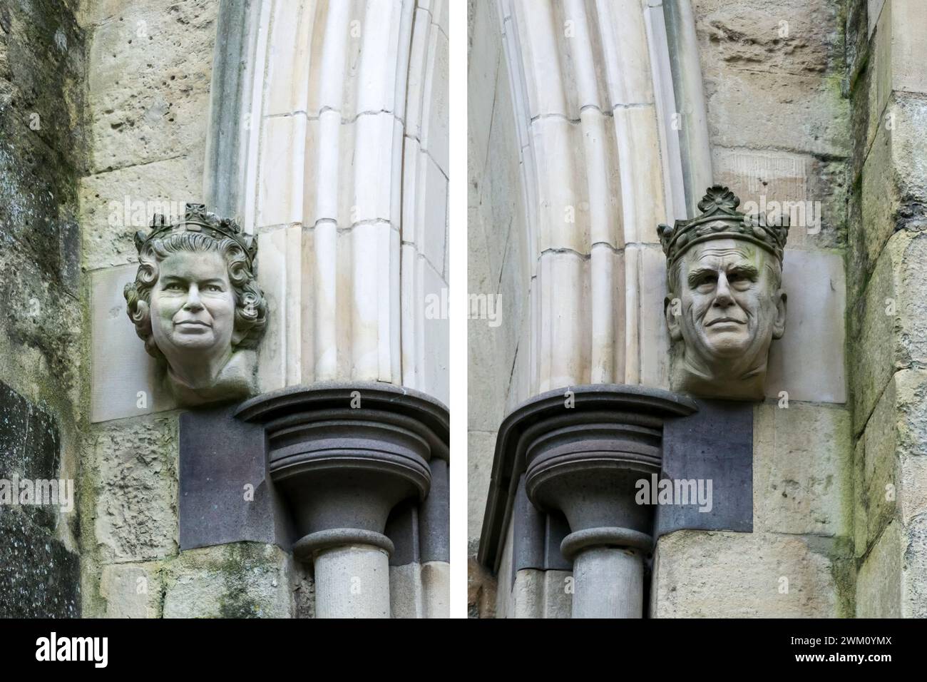 Carved corbel heads of Queen Elizabeth II and the Duke of Edinburgh either side of Chichester Cathedral west door.  They were installed in 2001. Stock Photo