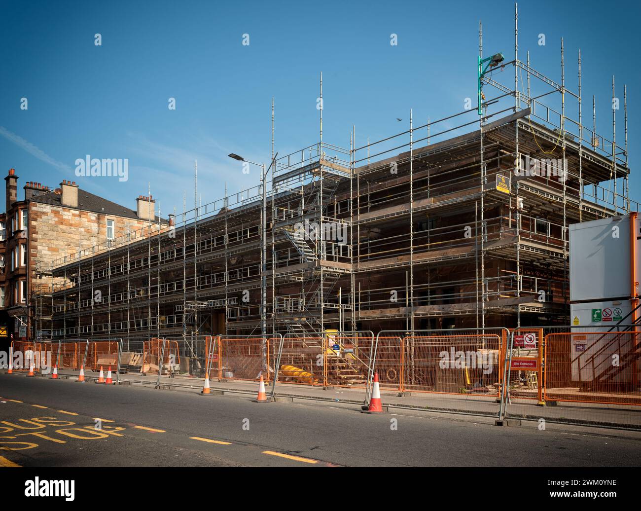 Scaffolding outside the Govanhill Baths swimming pool during construction rennovations in the south side of Glasgow 2023 Stock Photo