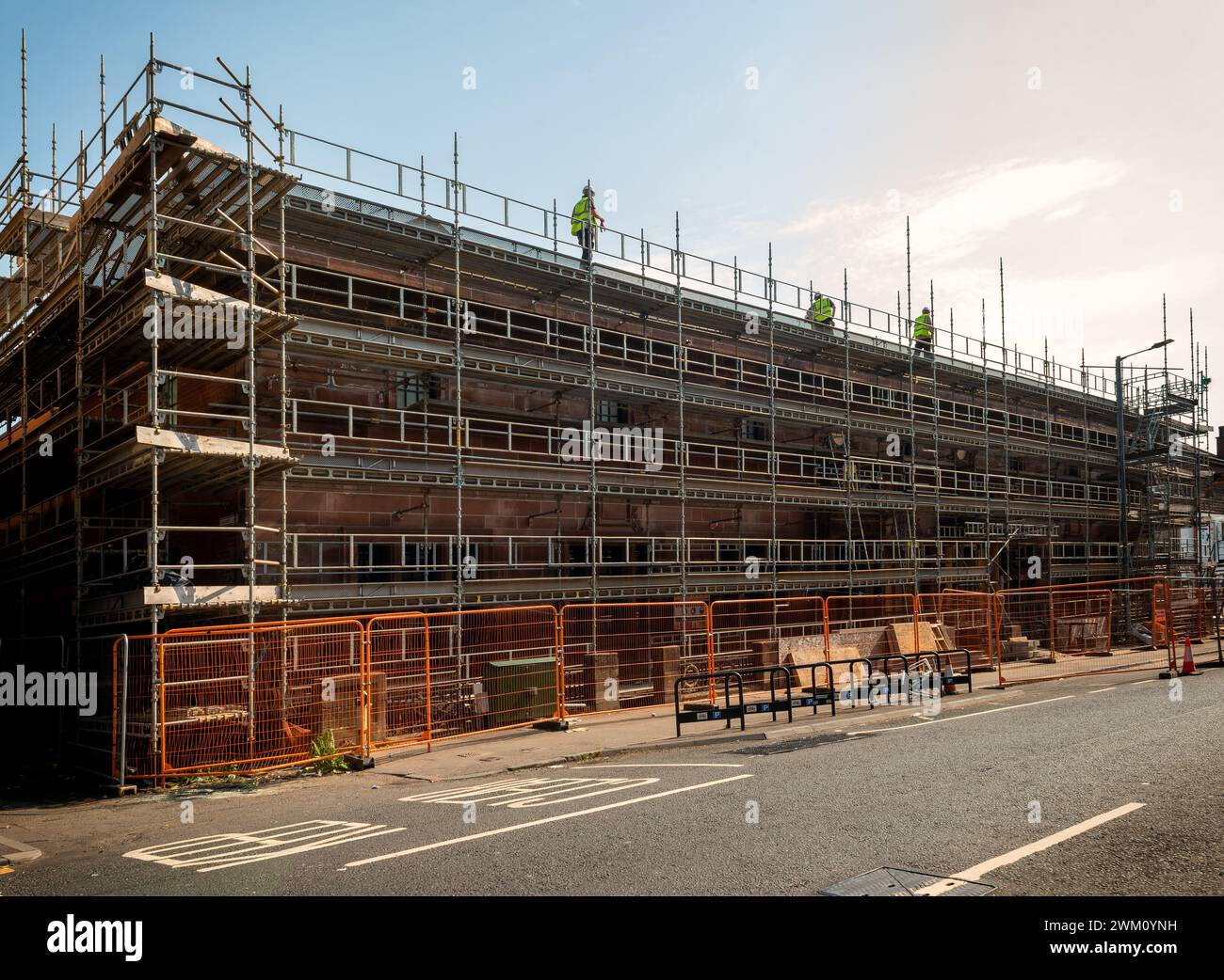 Scaffolding outside the Govanhill Baths swimming pool during construction rennovations in the south side of Glasgow 2023 Stock Photo