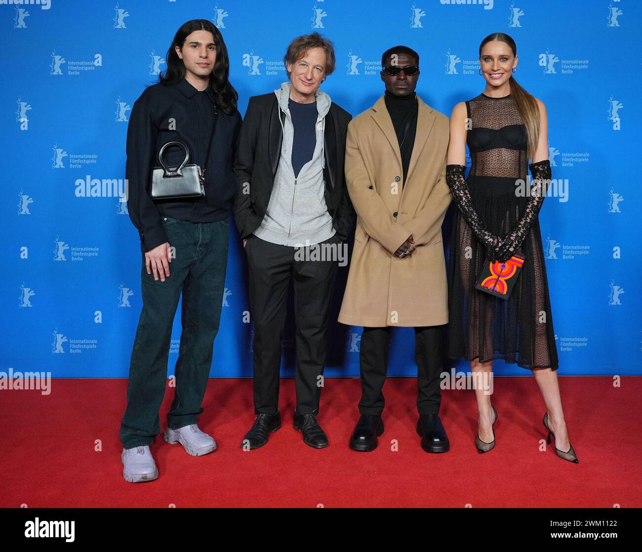 Berlin, Germany. 22nd Feb, 2024. Actors Benjamin Radjaipour (l-r), Jan Henrik Stahlberg, Fiifi Jefferson Pratt and Maja Simonsen attend the premiere of their film "Love By Proxy" at the Zoo Palast cinema. The fourth episode in the "Time - Crime" series starts in the Panorama section. The 74th Berlin International Film Festival will take place from February 15 to 25, 2024. Credit: Soeren Stache/dpa/Alamy Live News Stock Photo