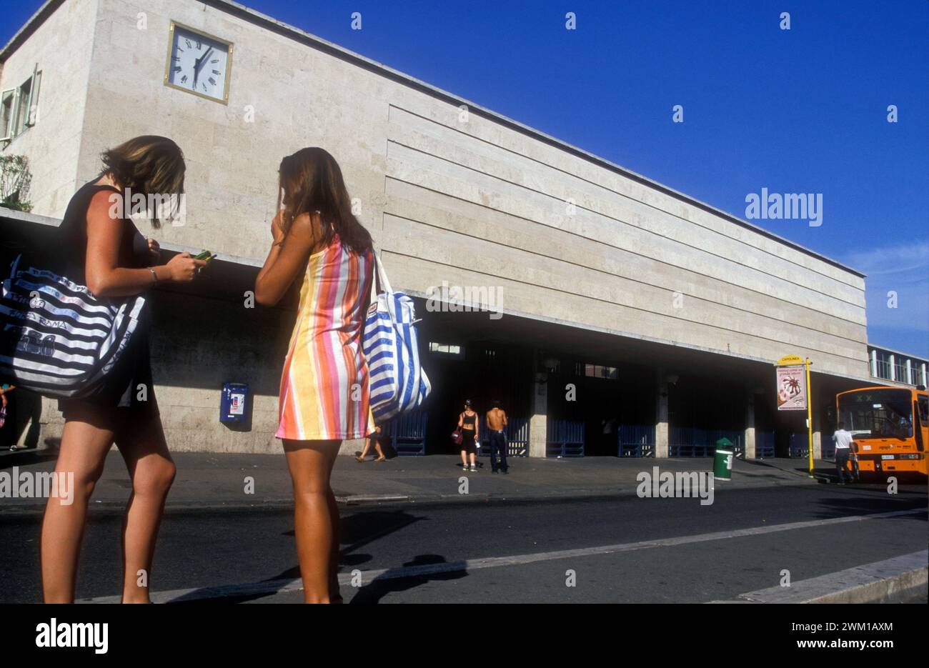 4066278 Two young women outside the station, Lido di Ostia, Italy 1999; (add.info.: Ostia Lido train station (Rome), 1999 / Stazione di Ostia (Roma), 1999 -); © Marcello Mencarini. All rights reserved 2024. Stock Photo