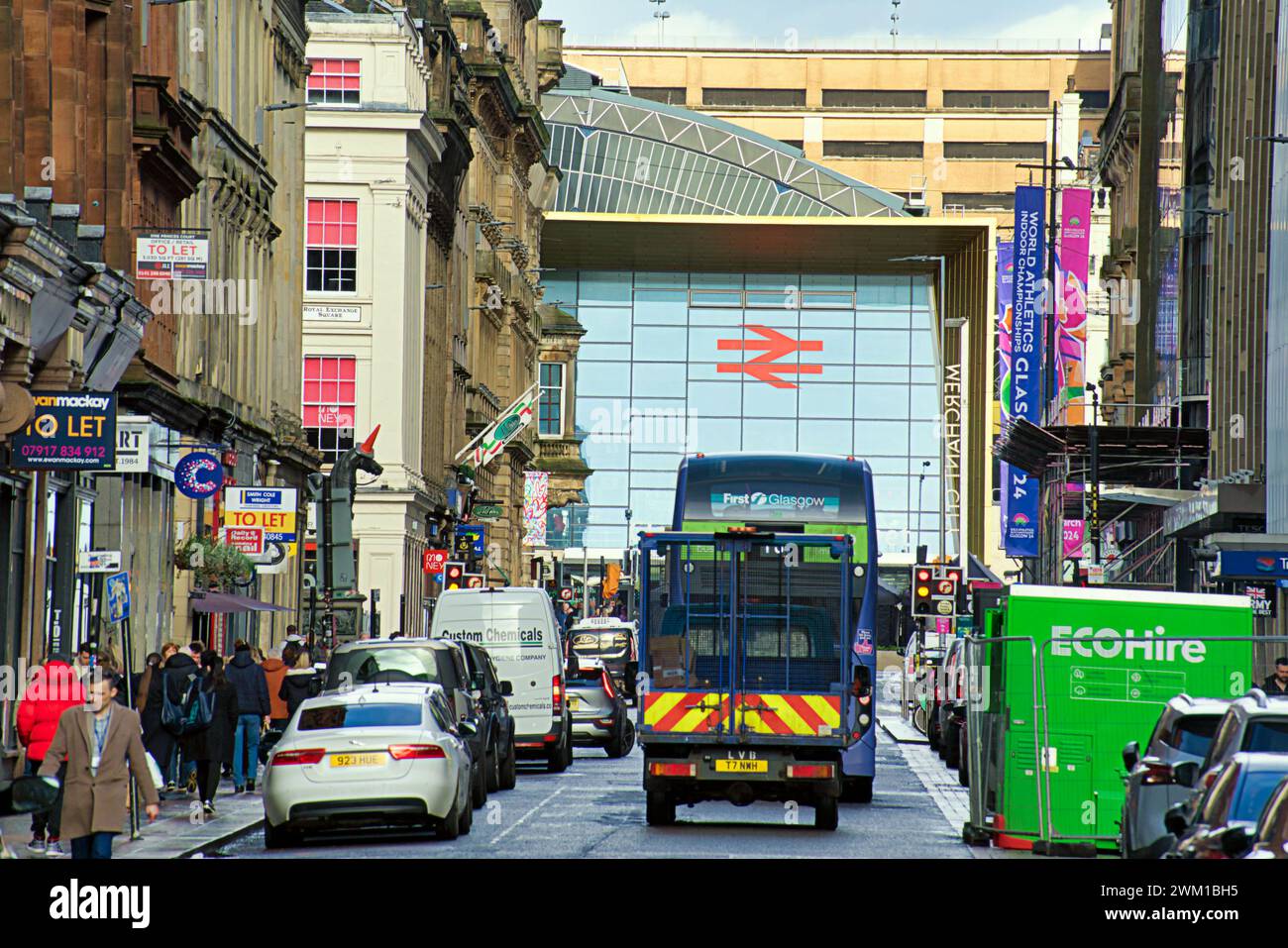 Glasgow, Scotland, UK. 23rd  February, 2024. UK Weather:  Heavy rain saw locals shelter under umbrellas on the style mile Queen street. Credit Gerard Ferry/Alamy Live News Stock Photo