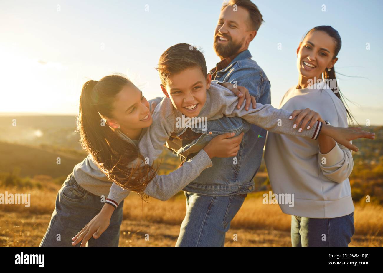 Happy family nature outdoor trip, spending weekend holiday together, parents, children enjoy time  Stock Photo