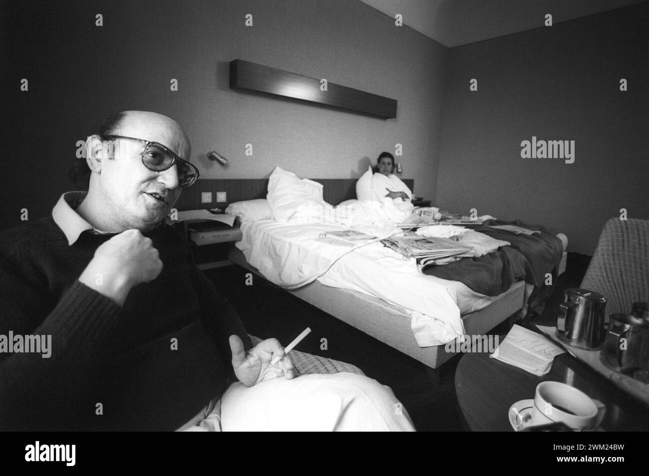 MME4775308 Cannes Film Festival 1983. Greek movie director Theo Angelopoulos in his hotel room/Festival del Cinema di Cannes 1983. He registered Theo Angelopoulos nella sua camera d'albergo -; (add.info.: Cannes Film Festival 1983. Greek movie director Theo Angelopoulos in his hotel room/Festival del Cinema di Cannes 1983. He registered Theo Angelopoulos nella sua camera d'albergo -); © Marcello Mencarini. All rights reserved 2024. Stock Photo