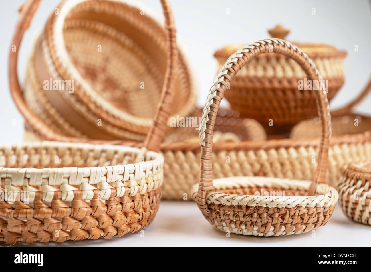 Wicker baskets isolated on white background. Basket made of natural materials, close-up Stock Photo