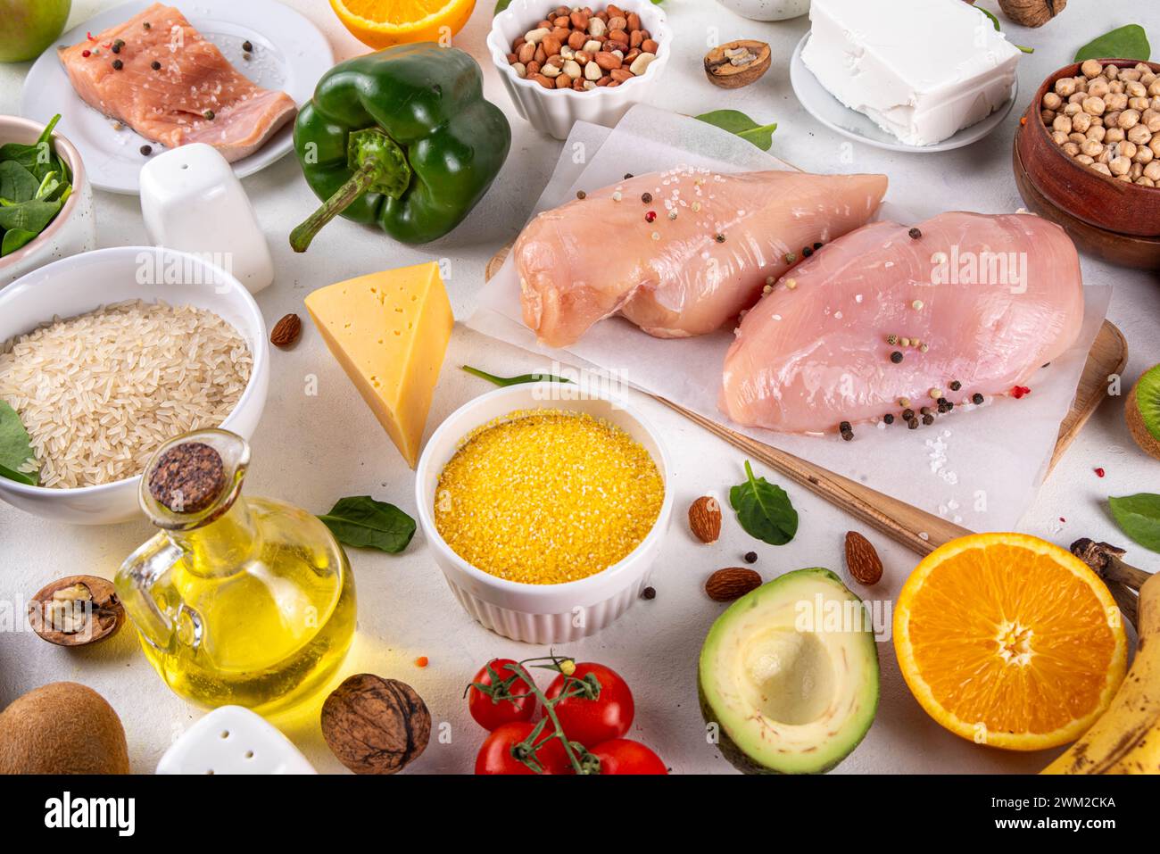 Clean Eating Diet foods background, fruits, vegetables, lean proteins, whole grains and healthy fats, nuts, legumes, chicken meat, fresh fish, beans o Stock Photo