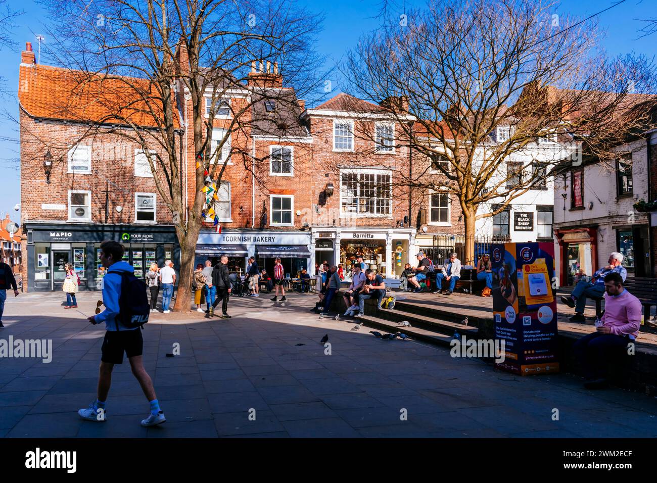King's Square is an open area in the city centre of York, in England. It is popular with tourists, who are often entertained by buskers and street per Stock Photo