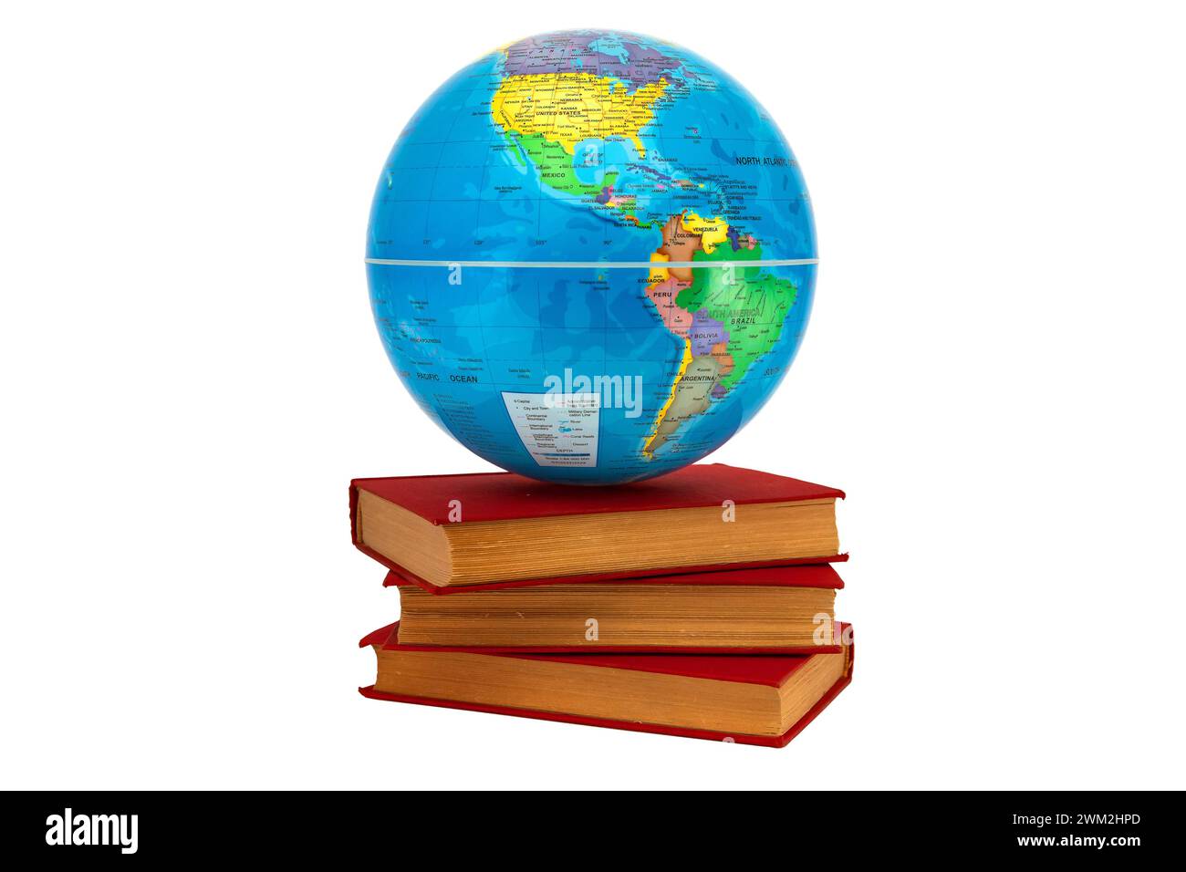 Earth globe on a stack of books where America is seen as a concept of knowledge. Books symbolize wisdom and knowledge that support the world. Stock Photo