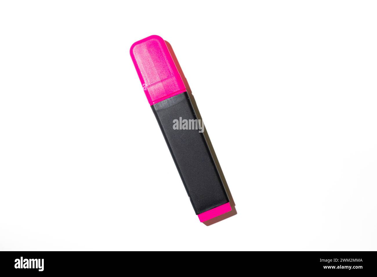Red highlighter pen laying on white background Stock Photo - Alamy