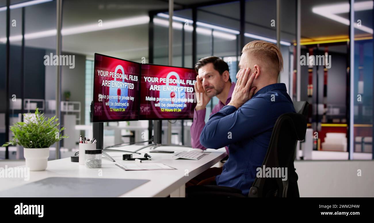 Office computer screens showing ransomware attack warning