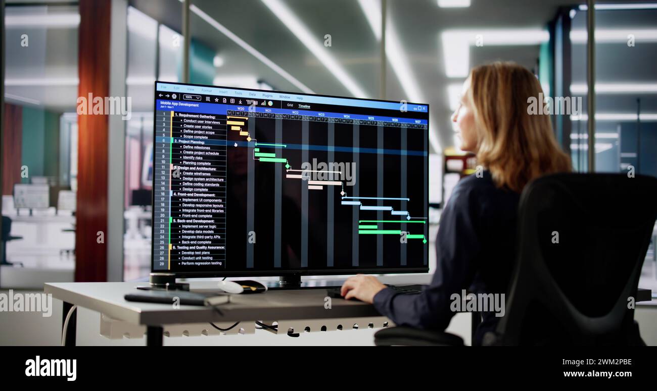 Data Analyst Woman Using Spreadsheet On Computer Stock Photo
