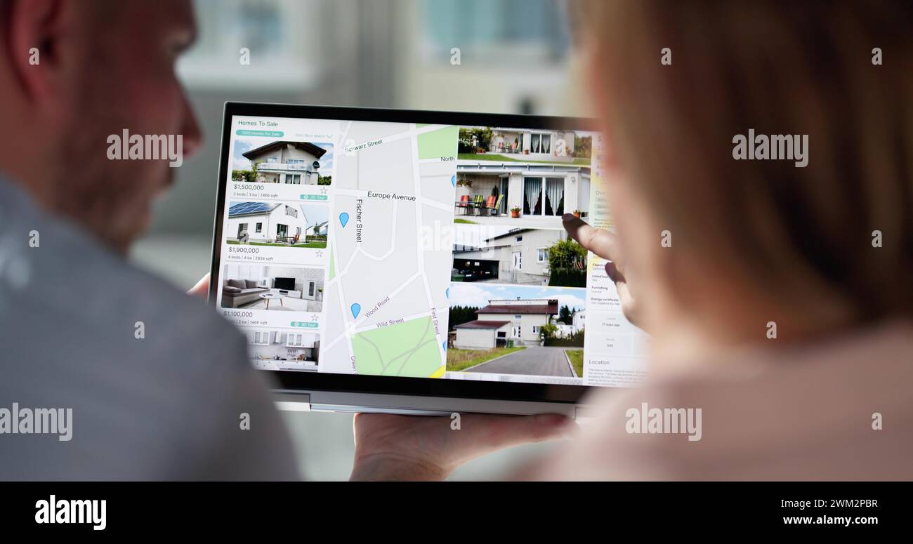 Couple Family Searching Real Estate Property Or House Online Stock Photo