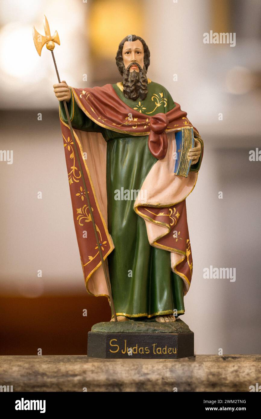 Statue of Saint Jude Thaddeus in blurred religious church background
