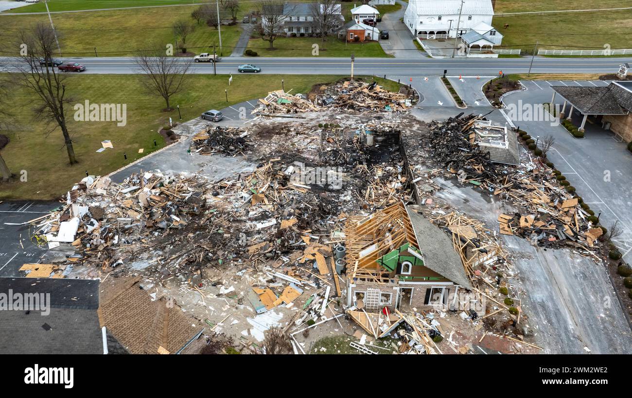 An Aerial View Of A Devastated Building Amidst Intact Structures With ...