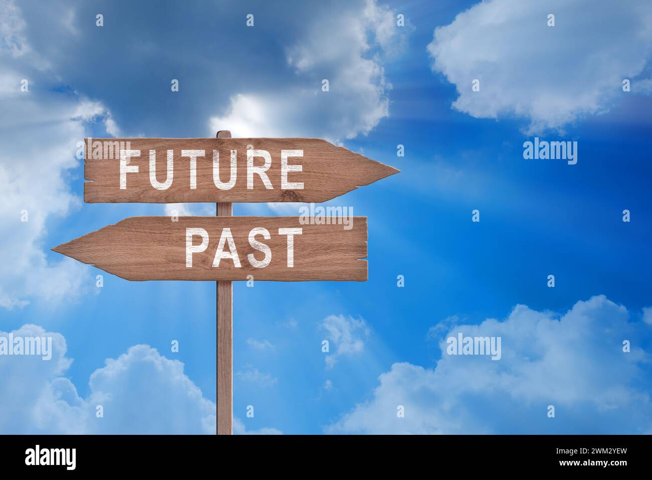 Future, present, past, wooden signpost concept. Stock Photo
