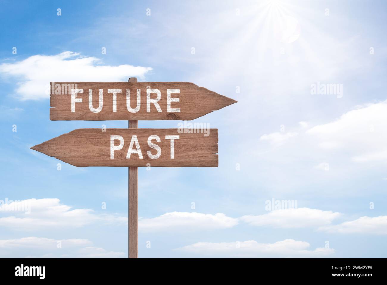 Future, present, past, wooden signpost concept. Stock Photo
