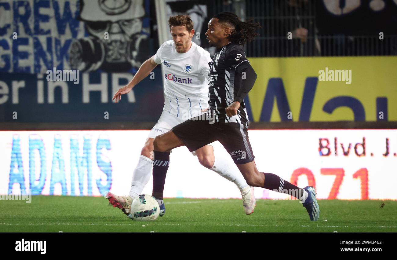 Charleroi, Belgium. 23rd Feb, 2024. Genk's Patrik Hrosovsky and Charleroi's Jeremy Petris fight for the ball during a soccer match between Sporting Charleroi and KRC Genk, Friday 23 February 2024 in Charleroi, on day 27 of the 2023-2024 'Jupiler Pro League' first division of the Belgian championship. BELGA PHOTO VIRGINIE LEFOUR Credit: Belga News Agency/Alamy Live News Stock Photo