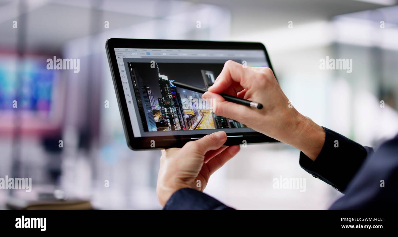 Graphic Designer Woman Working On Tablet Computer Screen Stock Photo