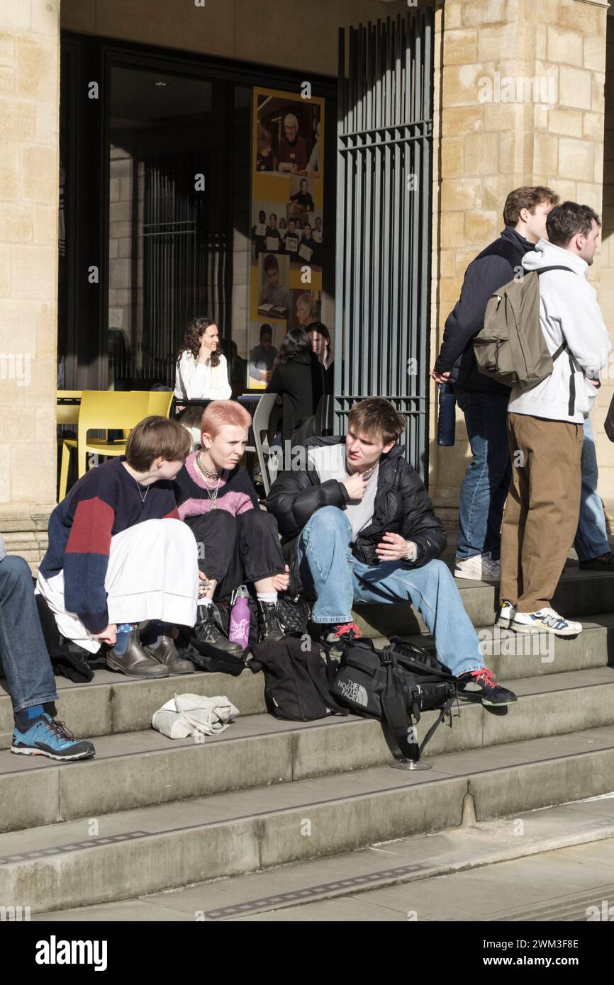 Around the University city of Oxford UK. Young people on the steps of the Weston Library Stock Photo