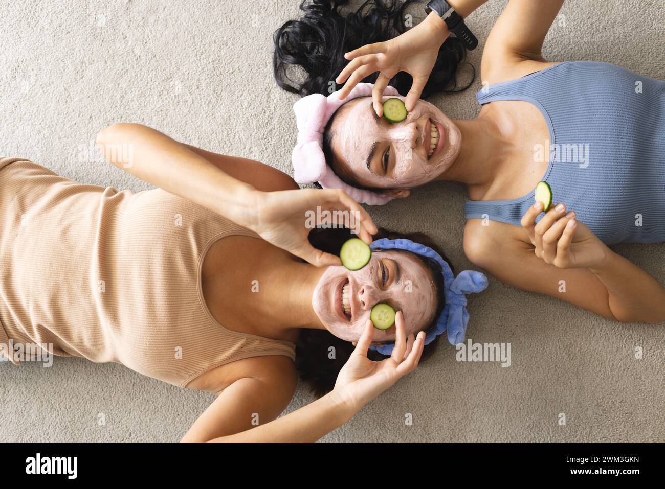 Two young biracial women enjoy a spa day at home Stock Photo