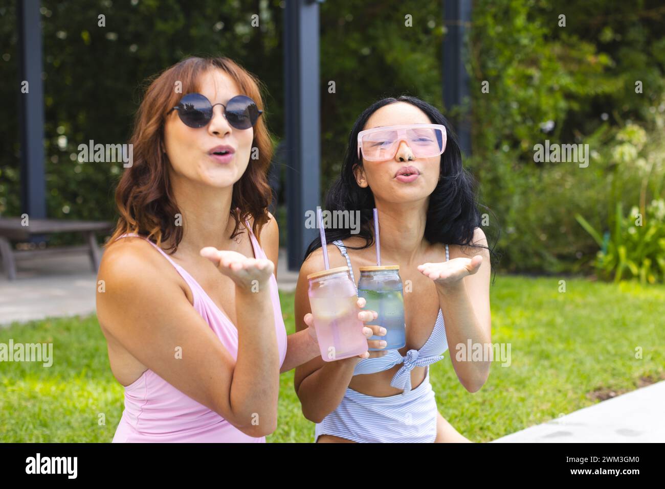 Two women enjoy a sunny day outdoors, with copy space Stock Photo