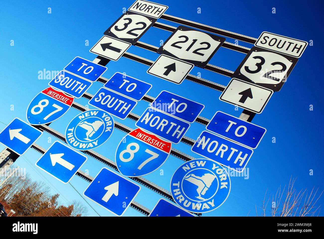 Signs point to different routes, roads and highways in Upstate New York providing options on transportation Stock Photo