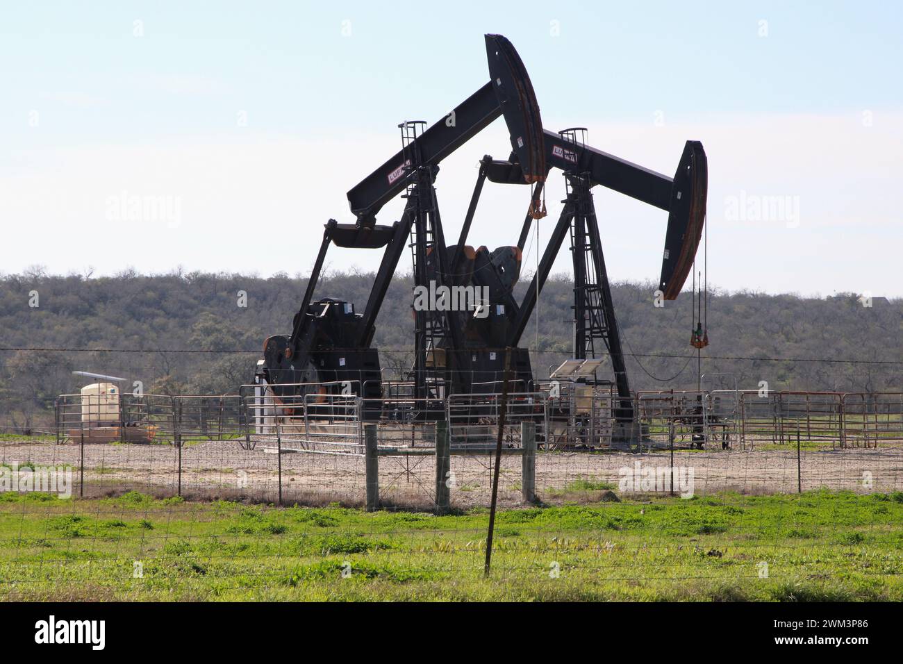 Falls City, USA. 23rd Feb, 2024. Oil pump jacks on a well pad near the ...