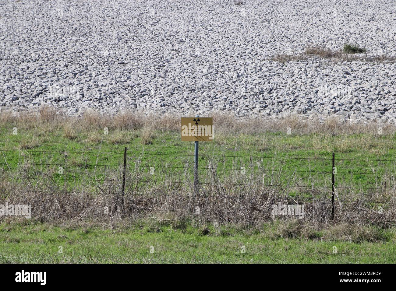 A “Uranium Mill Tailing Repository” and a “Radiation Warning” symbol on