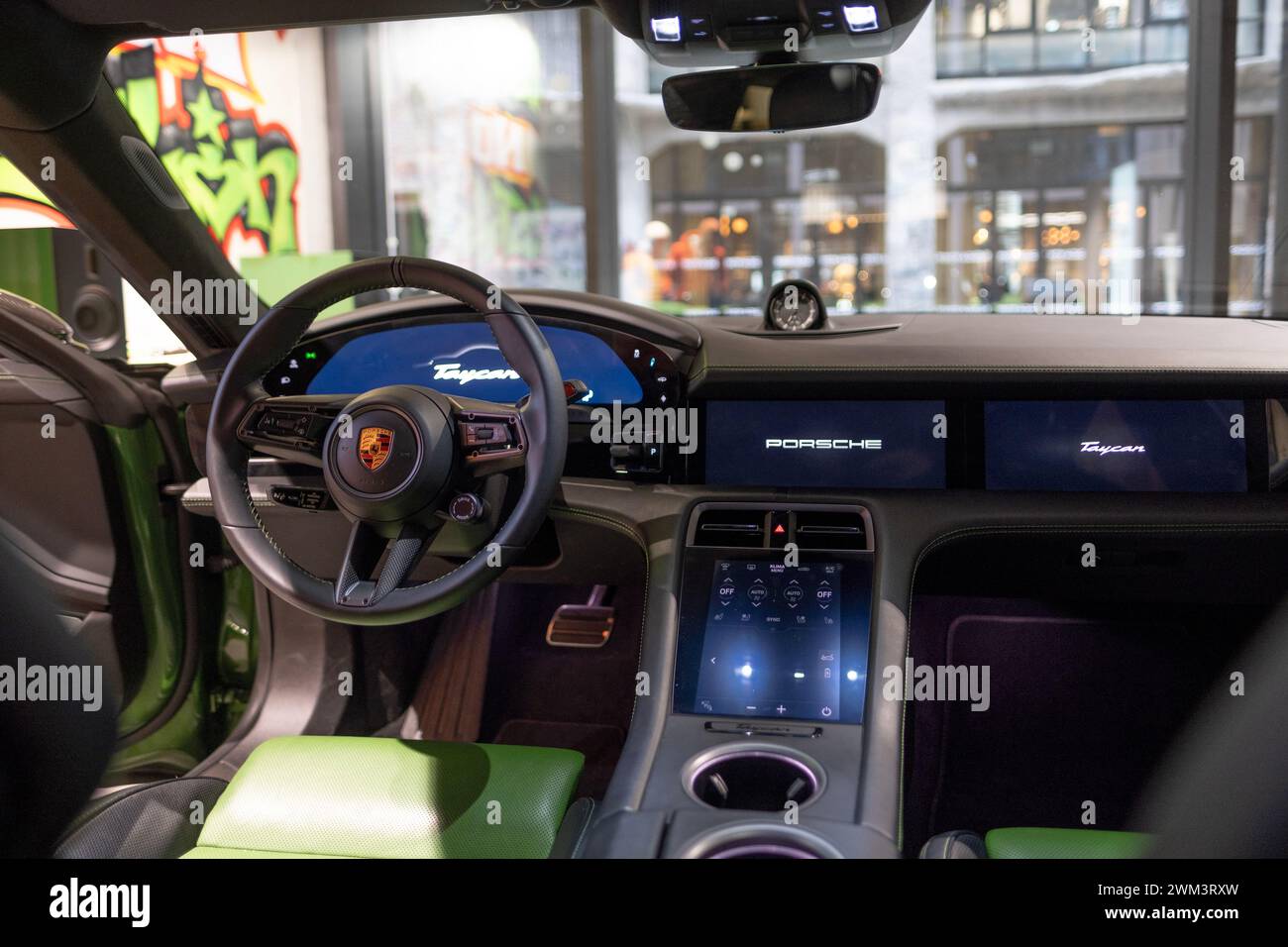 closeup steering wheel, Interior, cockpit of Porsche Taycan Turbo S battery-electric sports Car, sedan Porsche Automobil Holding, Innovation in automo Stock Photo