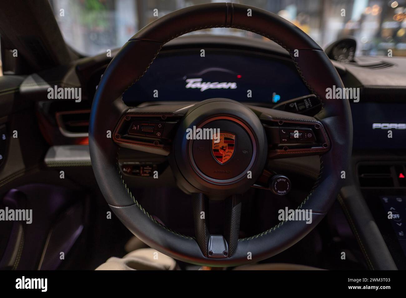 closeup steering wheel, Interior, cockpit of Porsche Taycan Turbo S battery-electric sports Car, sedan Porsche Automobil Holding, Innovation in German Stock Photo