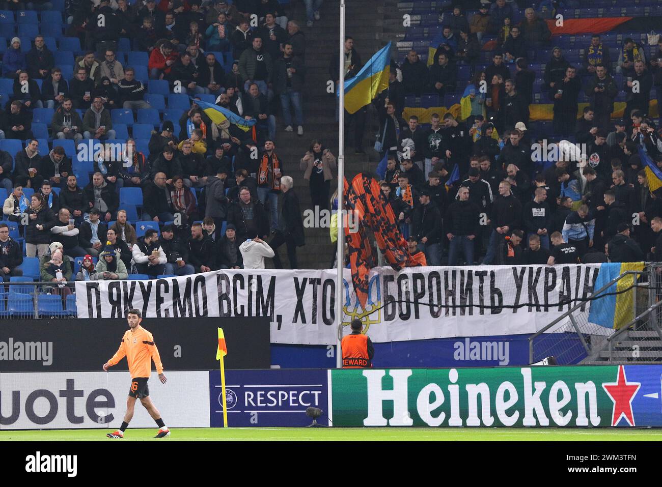 Hamburg, Germany - Feb 15, 2024: Ukrainian supporters with banner 'Thanks all who fights for Ukraine' on tribunes of Volksparkstadion in Hamburg during the UEFA Europa League game Shakhtar v Marseille Stock Photo