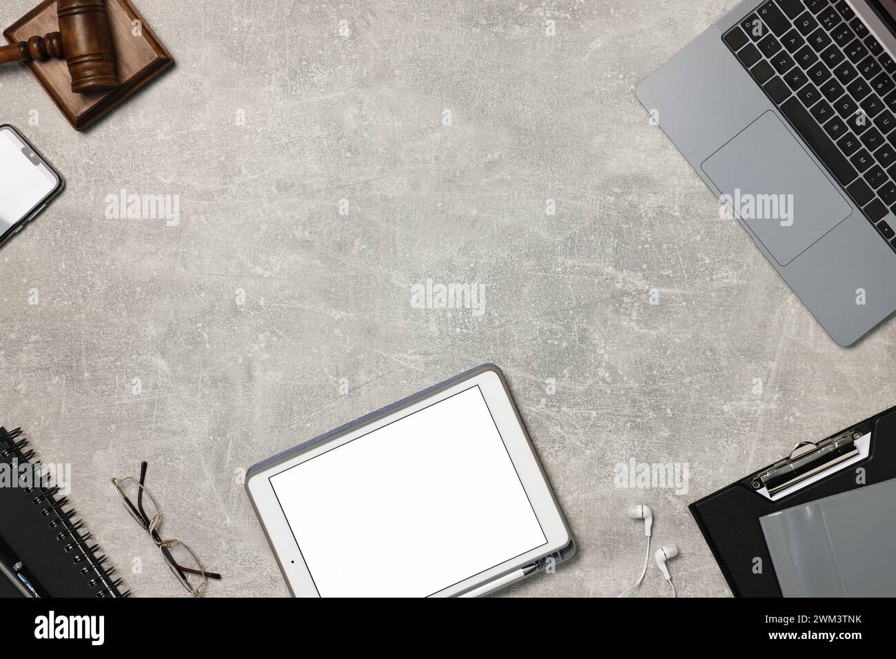 Flat lay composition with modern tablet on light gray textured table ...