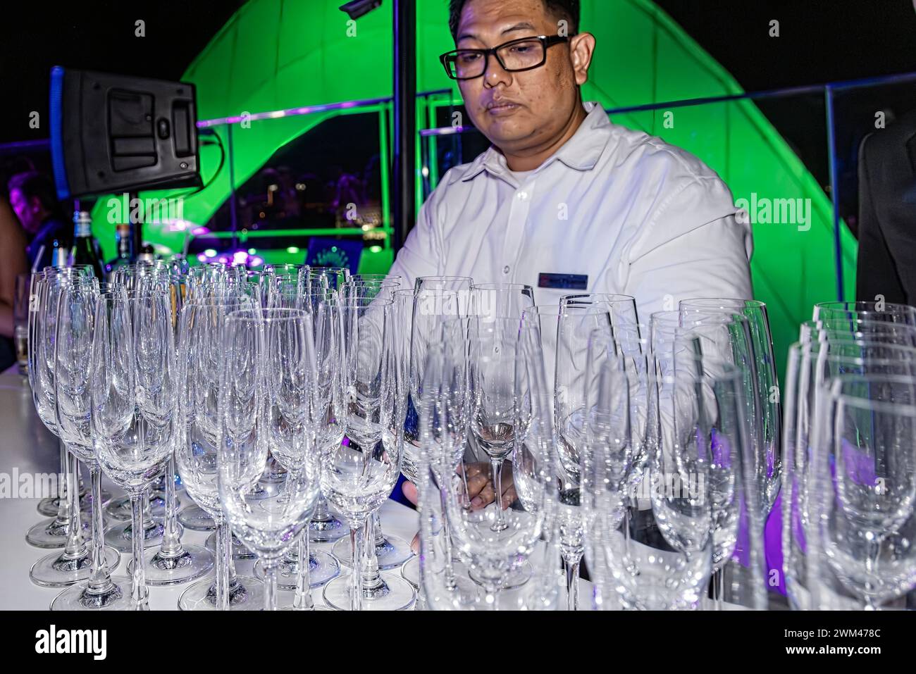 Empty champagne glasses ready for New Years Eve celebration, Bangkok, Thailand Stock Photo