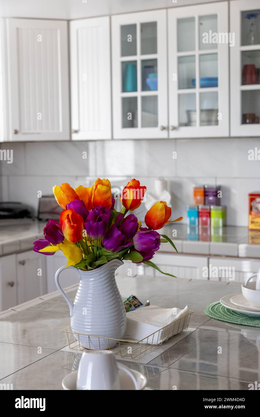 Colorful details create an inviting home stay destination and lodging alternative inside a Short Term Rental home's kitchen. Stock Photo