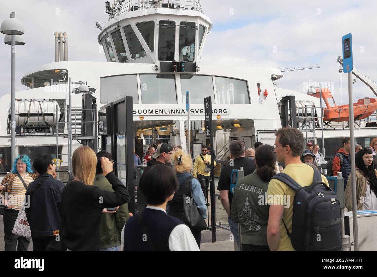 Helsinki, Finland - September 5, 2023: At the Market square people wait to board the public tranpsortation ferry to the Suomenlinna fortress. Stock Photo