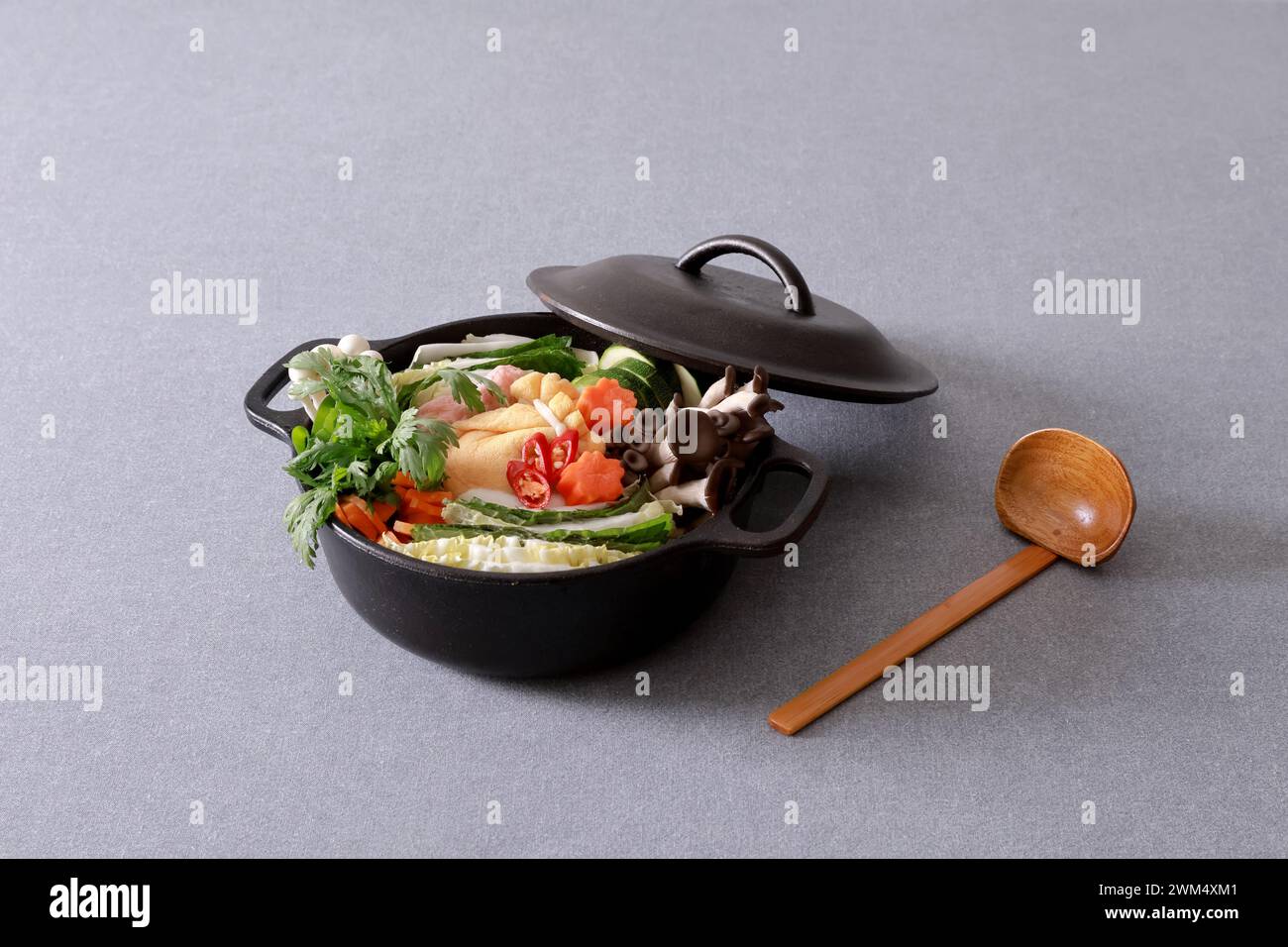 Korean food in black pot on gray background Stock Photo