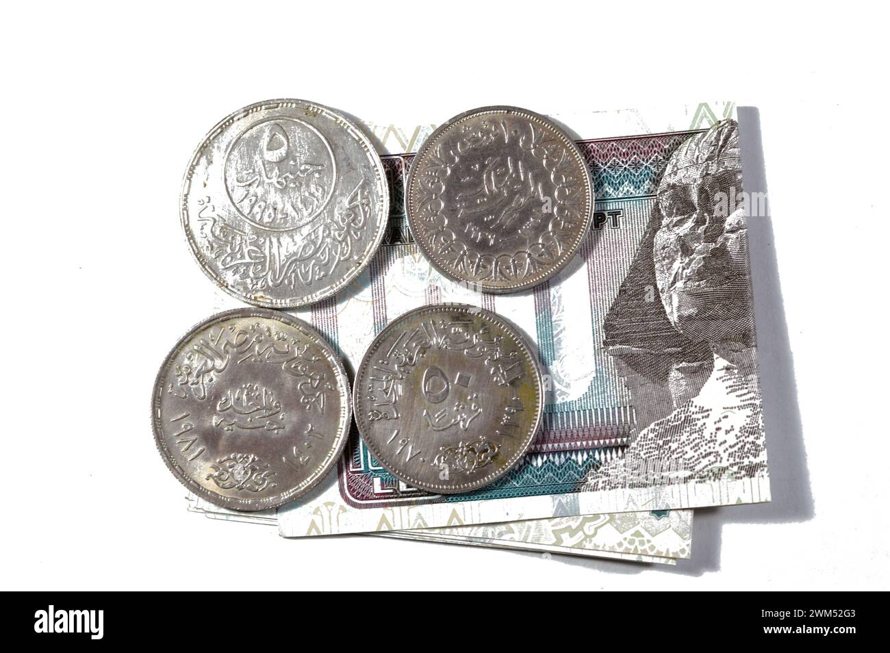 Egypt banknote with Egyptian silver coins of Orabi revolution, President Gamal Abdel Nasser, king Farouk I and the golden Jubilee of the Arab league, Stock Photo