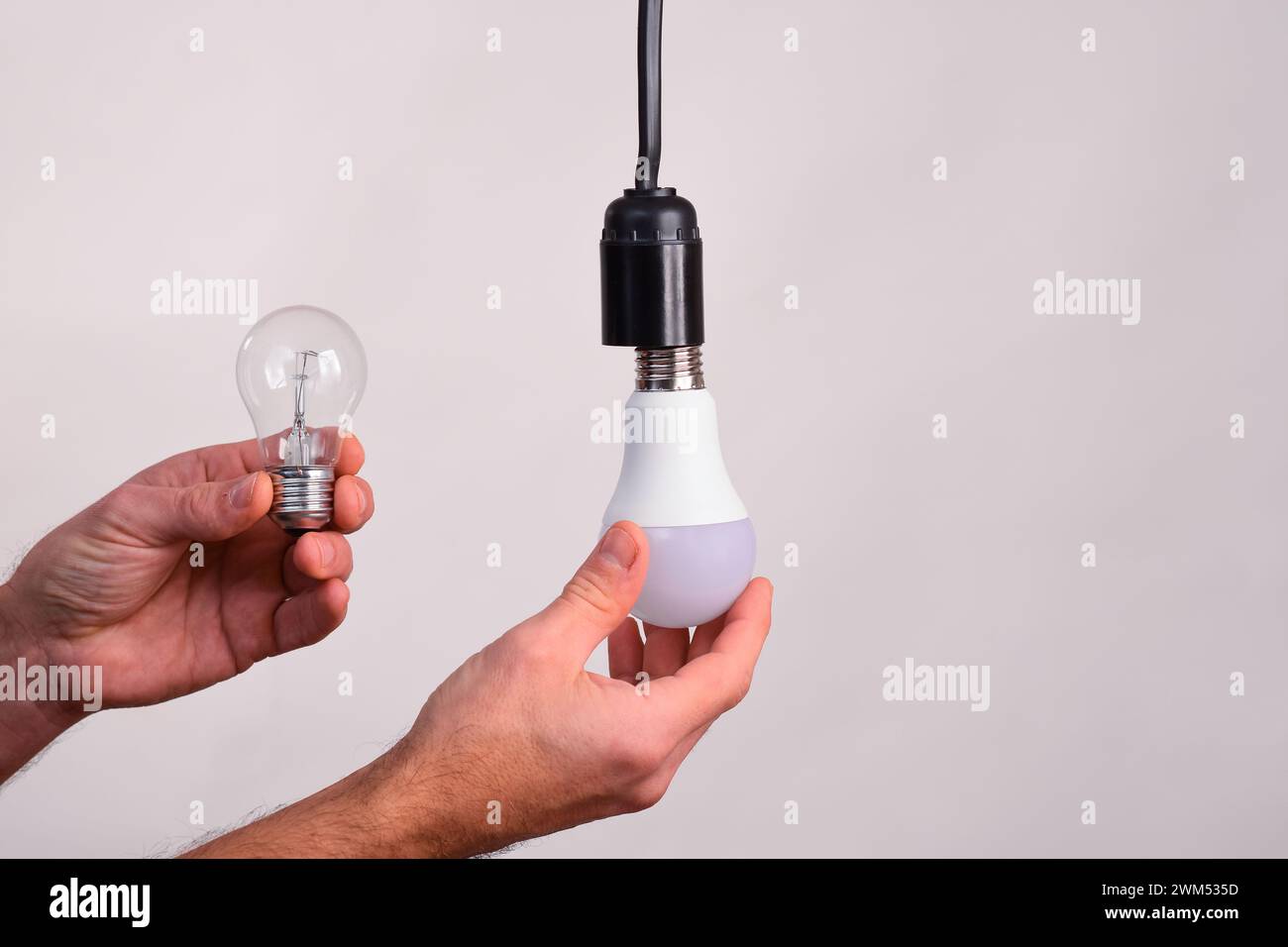 The incandescent light bulb is replaced with an LED lamp Stock Photo ...