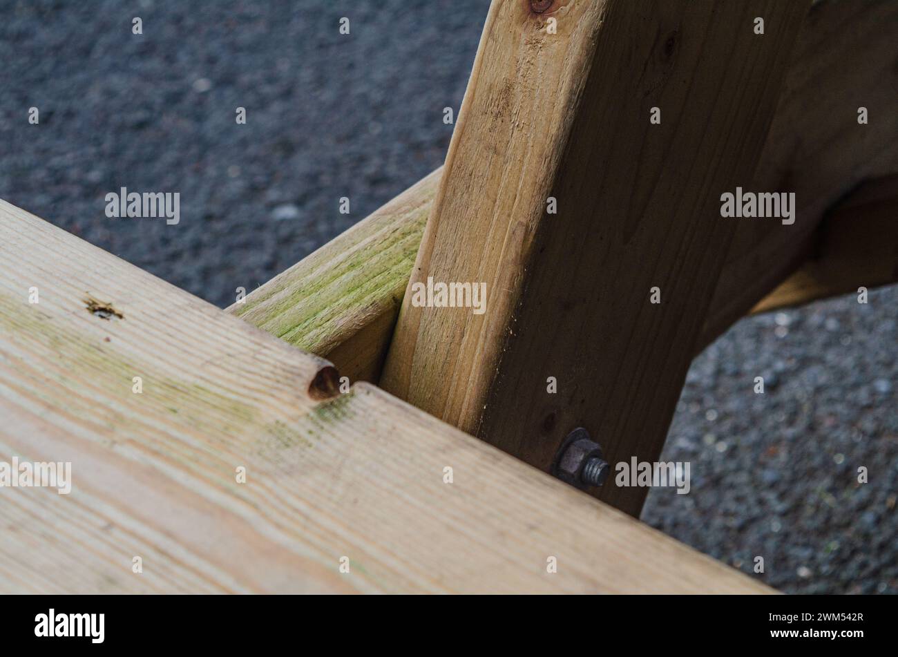 Close up of joint on a picnic bench for tourists in a local park in Queens University area of Belfast Stock Photo