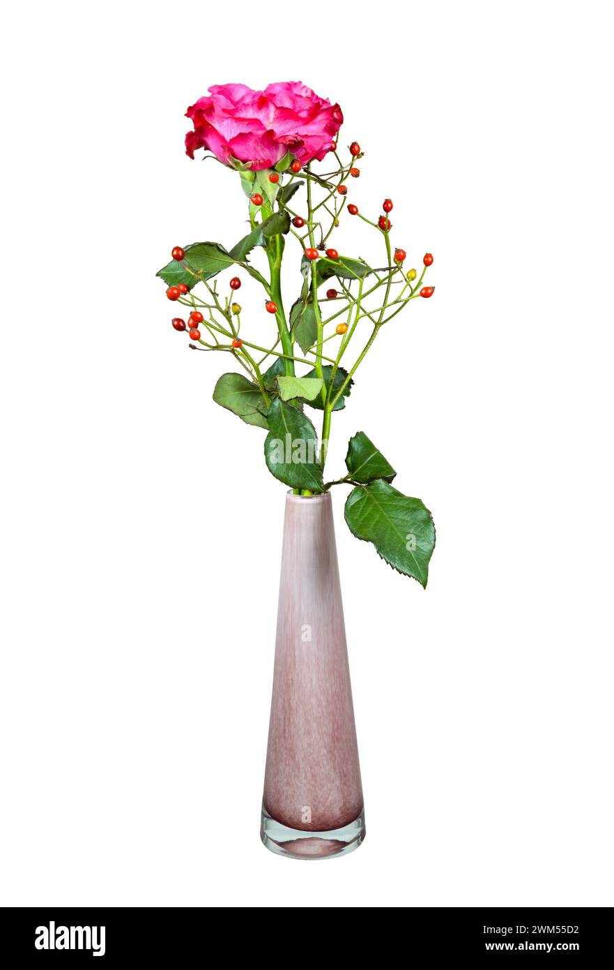 Closeup of an isolated flower arrangement with a rose in a glass vase Stock Photo