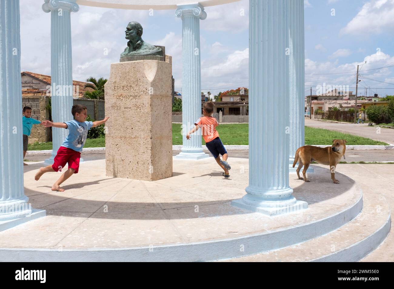 Children playing at the Hemingway monument in Cojimar near Havana. The poet was inspired in the fishing village to his novel 'The old man and the sea' Stock Photo