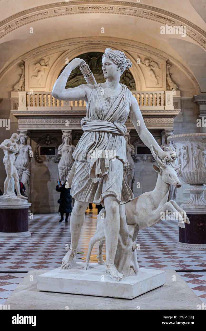 Diana of Versailles or Artemis, Goddess of the Hunt marble statue of the Roman goddess with a deer in Le Louvre Museum, Paris, France Stock Photo