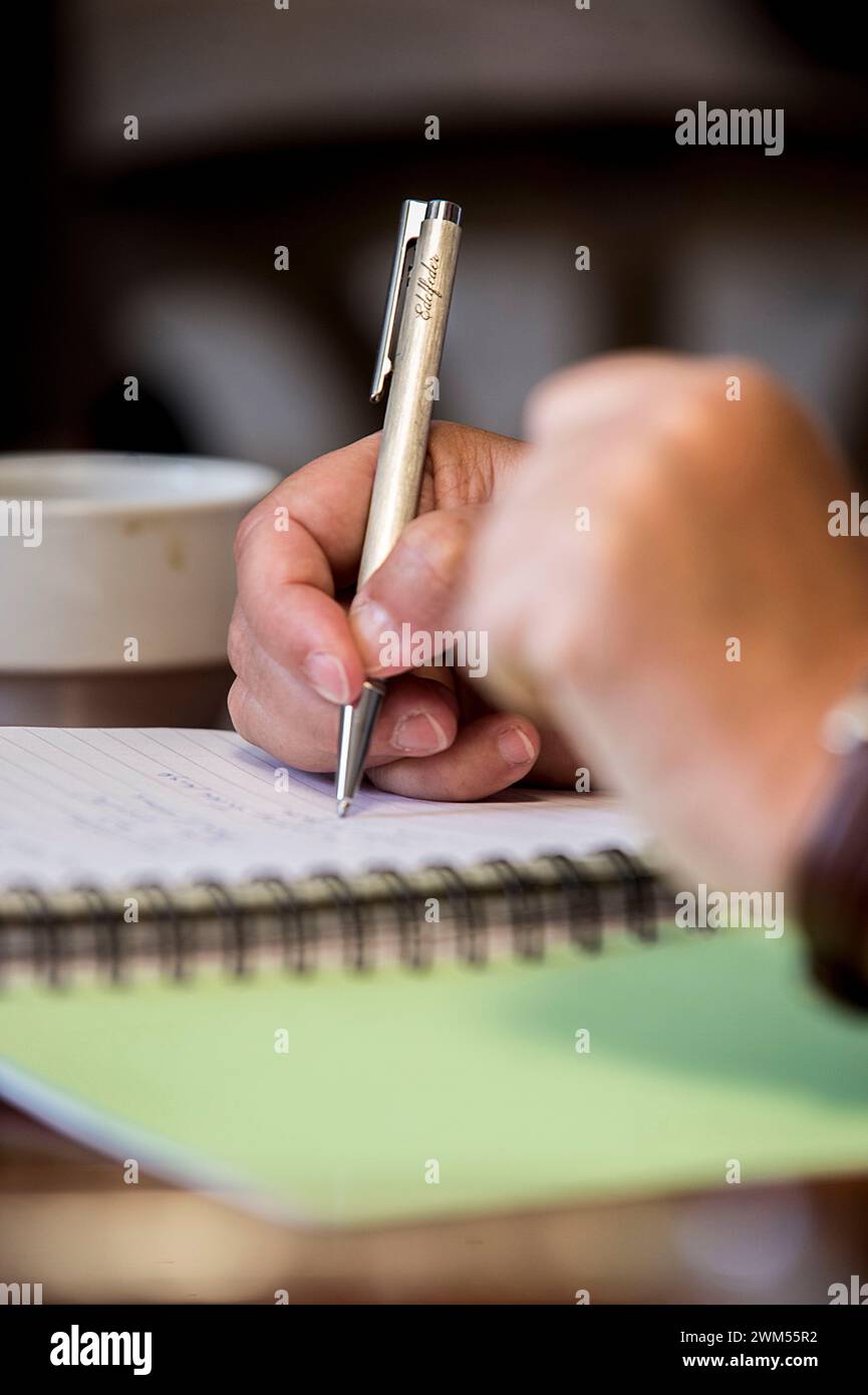 Images and words flow from the noble pen. Stock Photo