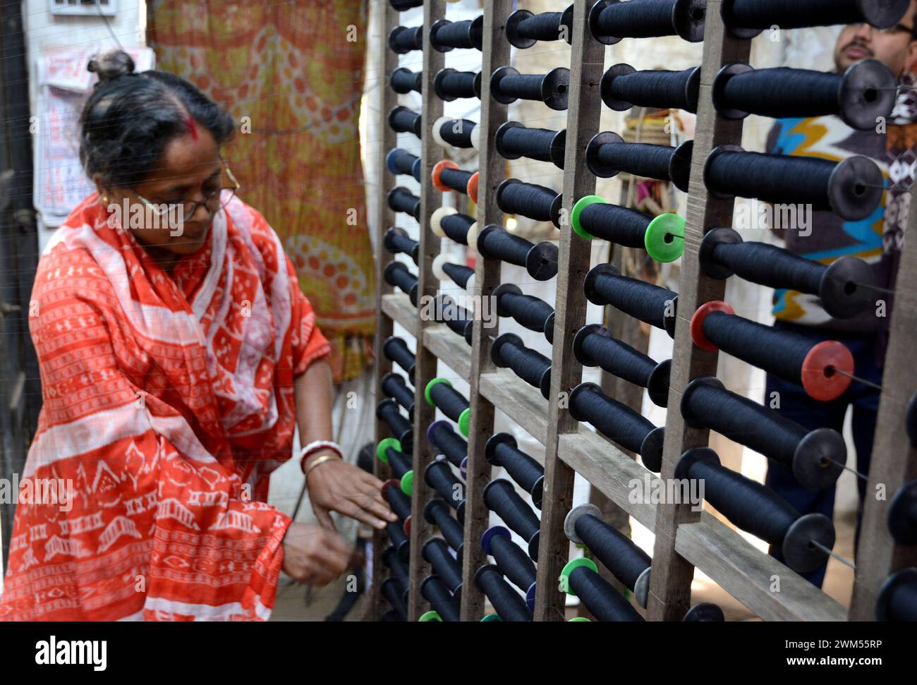 The old woman working in her own cotton thread factory at West Bengal ...