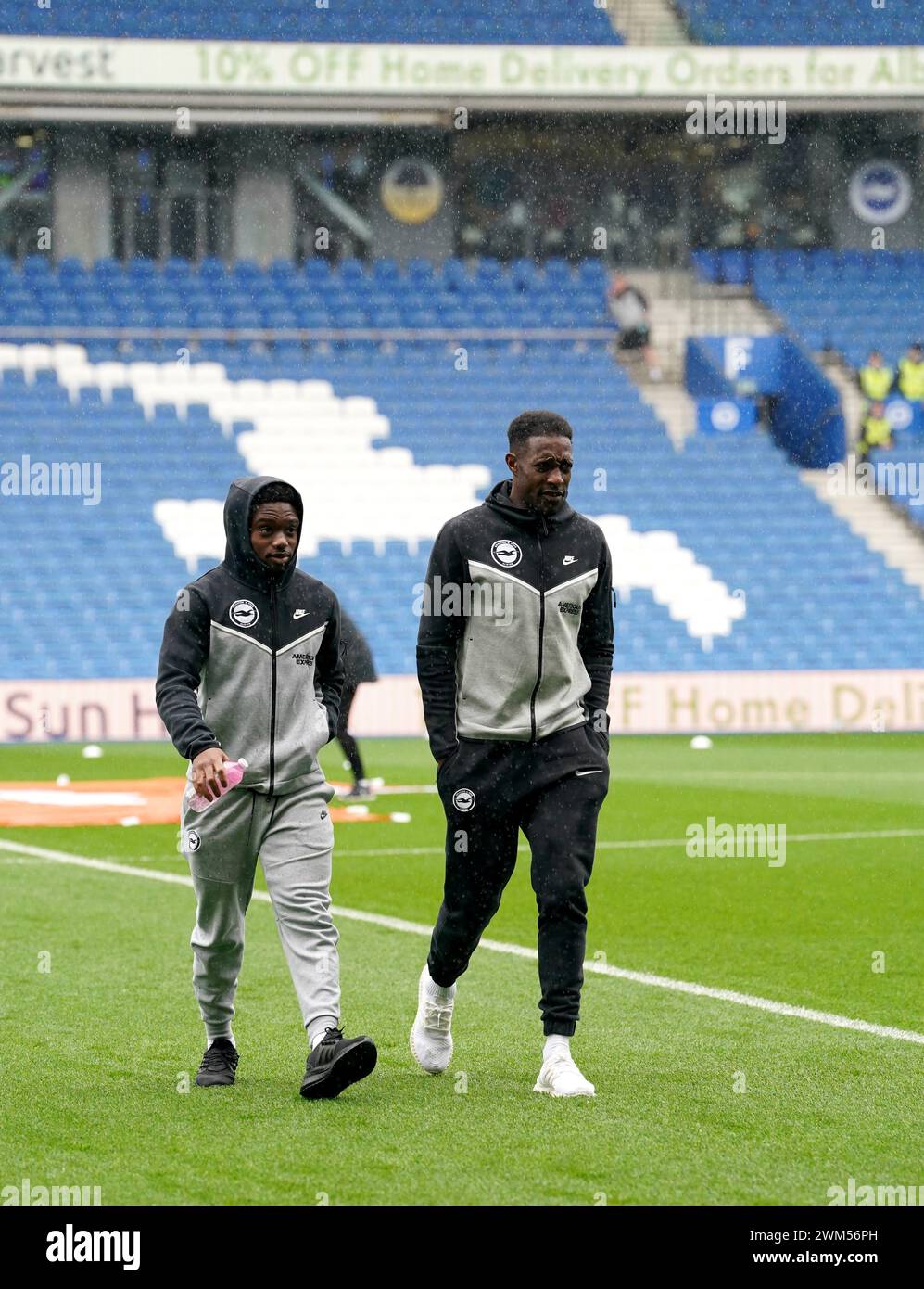 Brighton and Hove Albion's Tariq Lamptey (left) and Danny Welbeck arrive at the ground ahead of the Premier League match at the American Express Stadium, Brighton. Picture date: Saturday February 24, 2024. Stock Photo