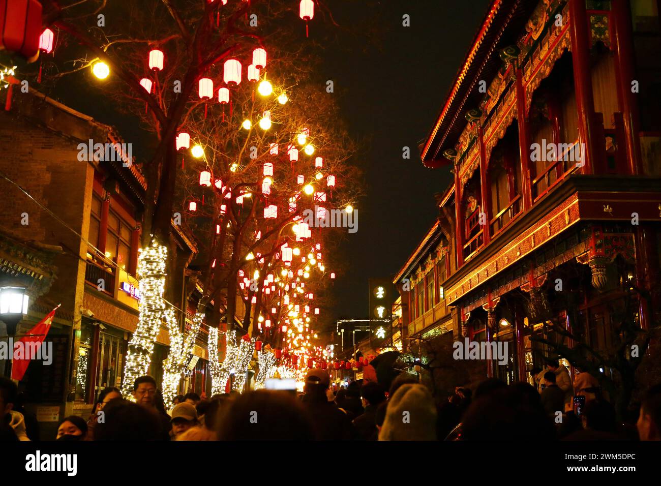 Beijing, China. 24th Feb, 2024. People watch lanterns and light installations in Beijing, capital of China, Feb. 24, 2024. Various events are held across the country to celebrate the Lantern Festival, the 15th day of the first month of the Chinese lunar calendar, which falls on Feb. 24 this year. Credit: Zheng Huansong/Xinhua/Alamy Live News Stock Photo