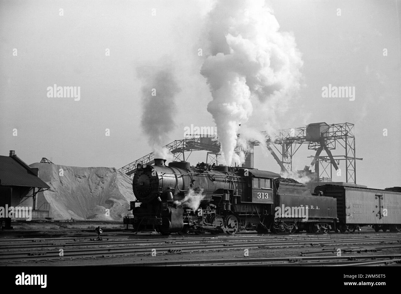 Locomotive in action - Railroad yards along riverfront, St. Louis, Missouri, Arthur Rothstein photo 1939 Stock Photo
